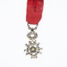 Belle médaille miniature d’officier de l'ordre de la légion d’honneur ornée de diamants. Centre en or en deux parties.