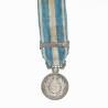 Miniature de la médaille coloniale avec son ruban et agrafe « Algérie ».