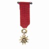 Médaille miniature de la légion d'honneur en or, diamants et émeraudes.
