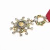Médaille miniature de la légion d'honneur en or, diamants et émeraudes.