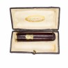 Ancien fume cigare avec bague et écu en or.