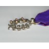 Miniature medal of academic palms with diamonds, rubies and ribbon.