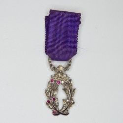 Luxury medal of academic palms in reduction adorned with diamonds and rubies.