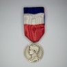 Silver labor medals with ribbon.