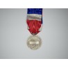 Silver labor medals with ribbon.