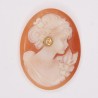 Beautiful old oval cameo, representing the profile of a woman, with gold ear nail setting a diamond.