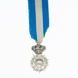 Belle médaille de l’ordre du Nicham El Anouar en miniature.